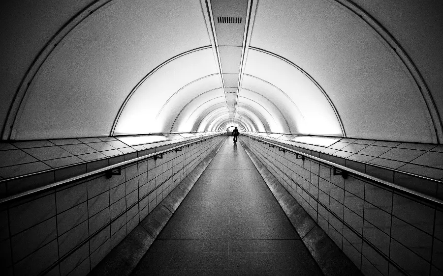 The latest black and white profile picture of a lonely man in a shining tunnel with 8k quality 
