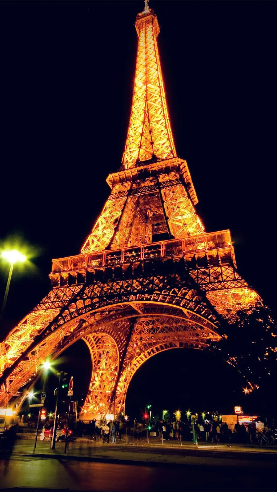 Download a high-quality background very close and huge at night of the famous Eiffel Tower in the country of culture, France, the city of Paris