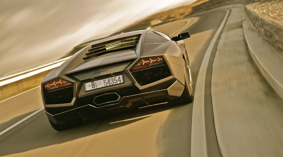 Download Stock Image and with the Speed ​​and Power of Lamborghini Runton on a Dirt Road
