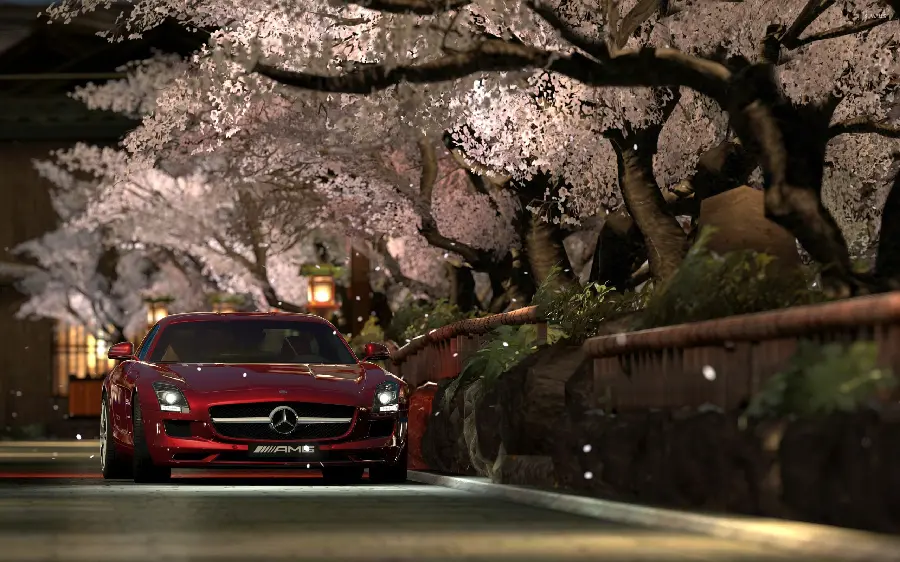 Enchanted wallpaper of red Mercedes-Benz next to blooming trees
