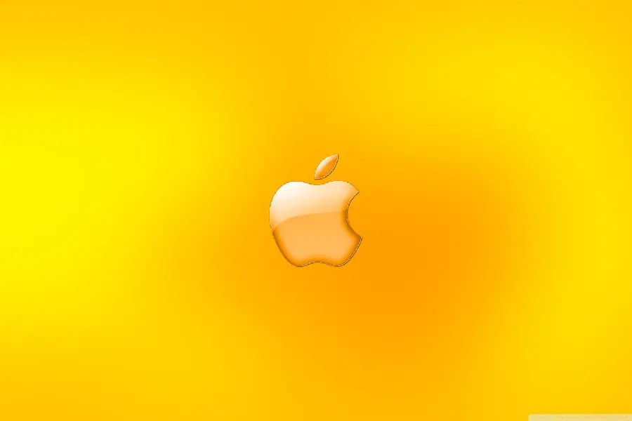 Apple iPad wallpaper with a bright bitten apple and peach and yellow colors around it