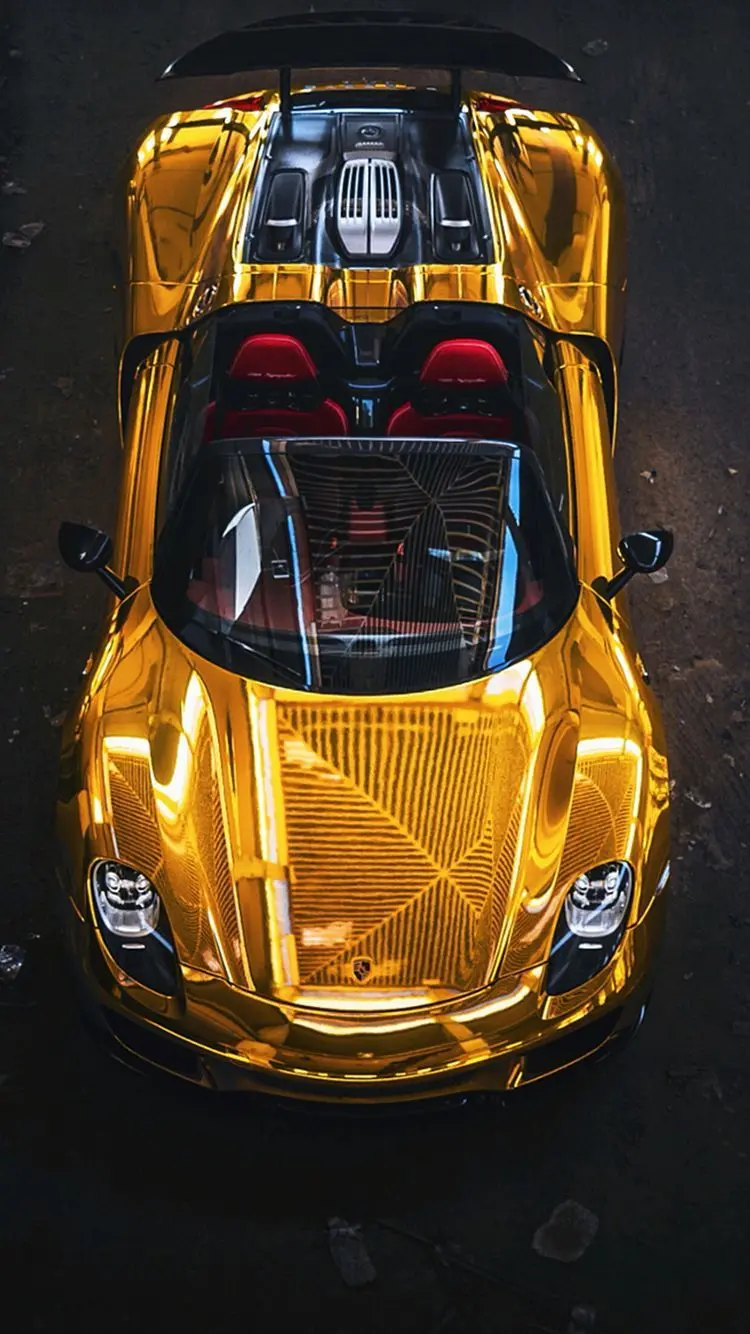 A special and amazing view of a golden Ferrari with a masterpiece shine