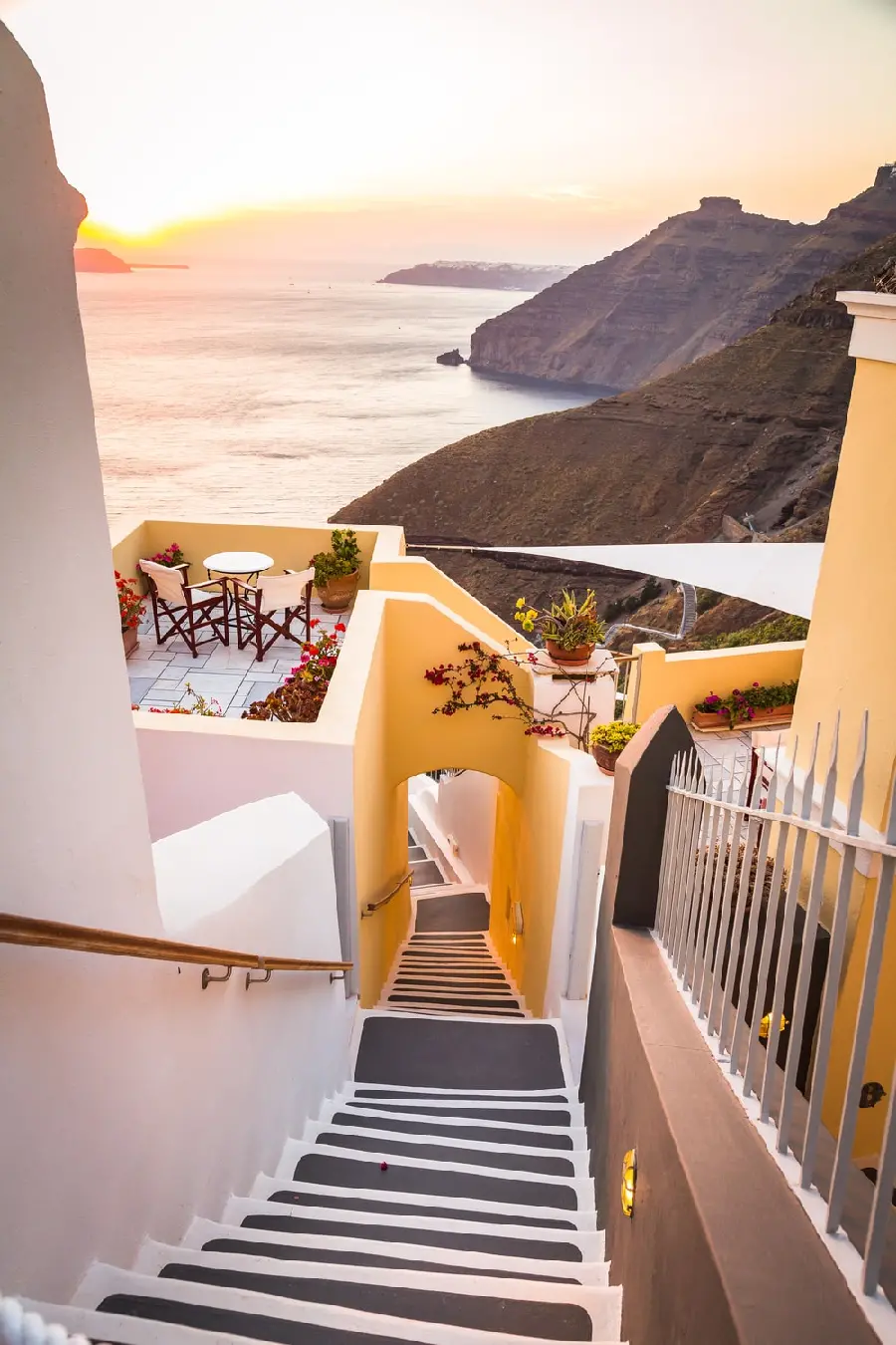 Unique poster of orange walls and stairs and balconies overlooking the sea in Santorini