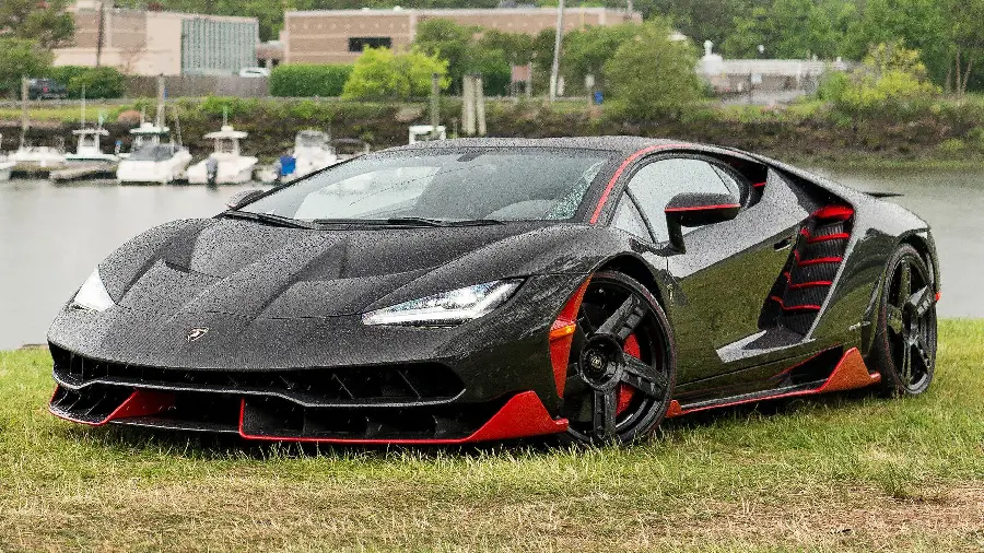 Full HD Wallpaper of a Black Lamborghini on the Edge of a Spectacular Lake