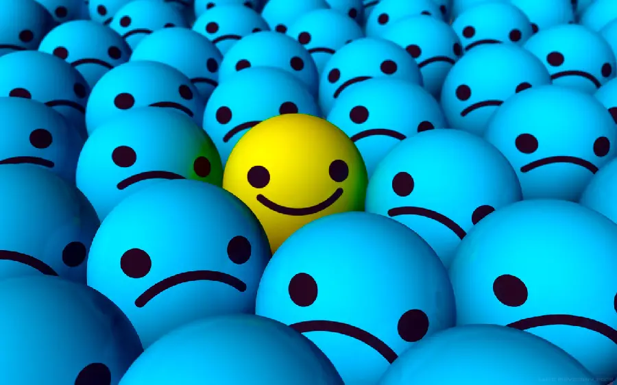 Smiling yellow emoji among blue sad emojis suitable for wallpaper