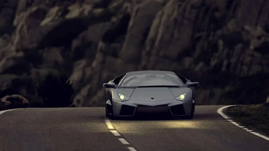 Glorious wallpaper of Lamborghini Runton with lights on the road at night