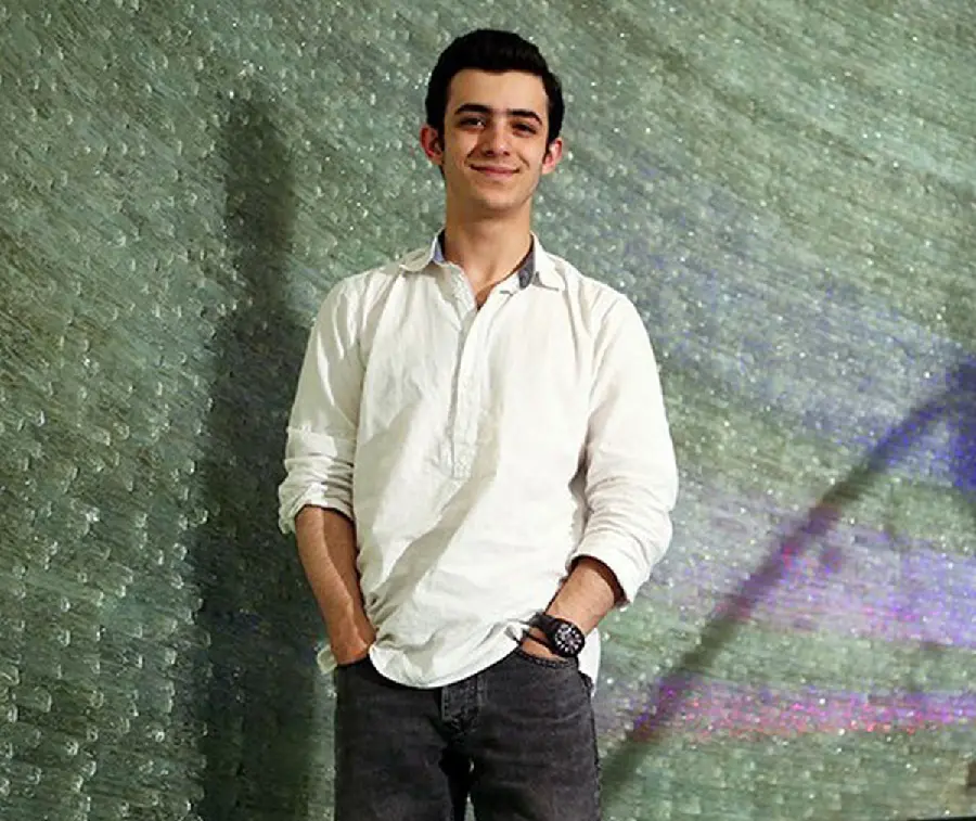 Ali Shadman laughing wallpaper with a white shirt
