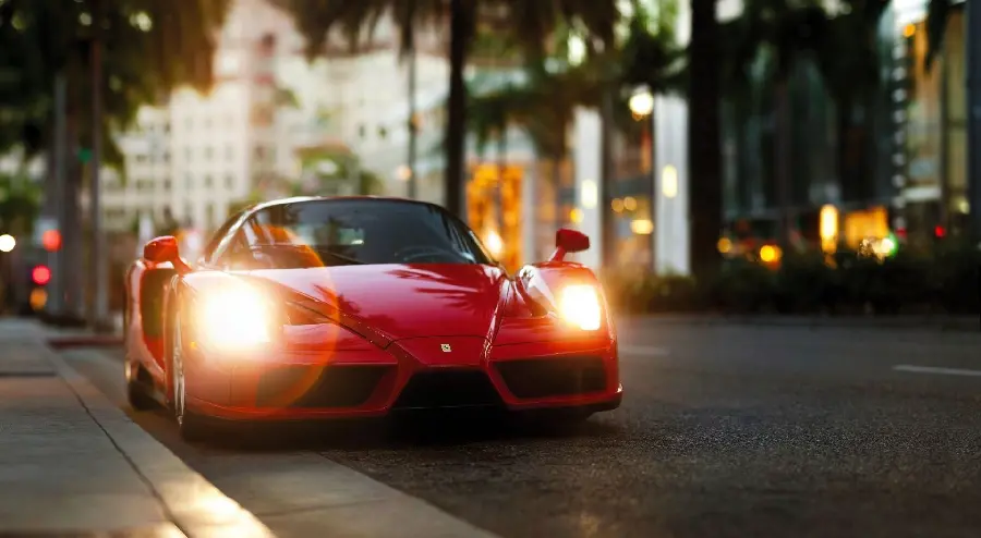 Download stock photo of a wonderful Ferrari Enzo with bright lights on the street