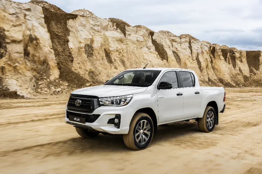The latest picture of a white Toyota Hilux in the mountains for Instagram