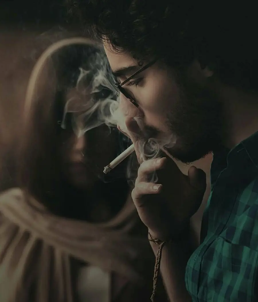 Mysterious and dark picture of a smoking boy in love and a girl in an interesting view