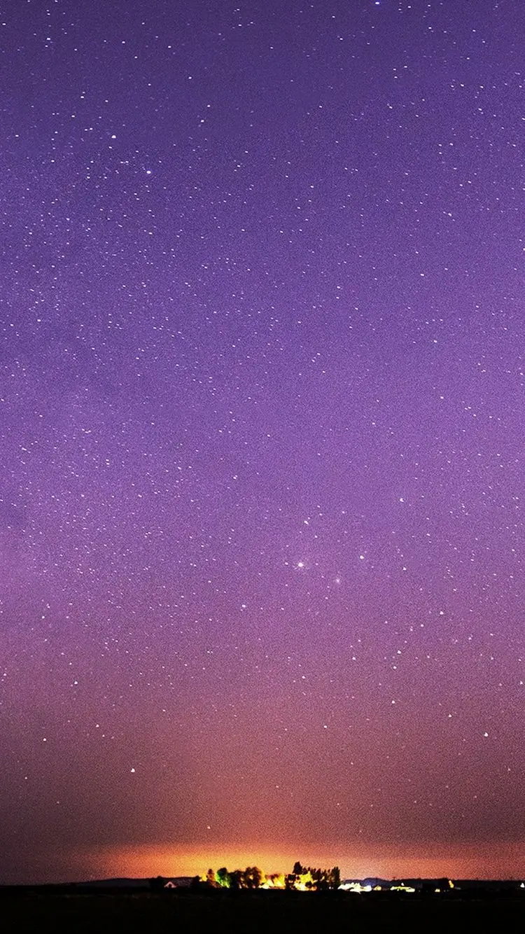 New fantasy photo of a sky with tiny purple and orange stars