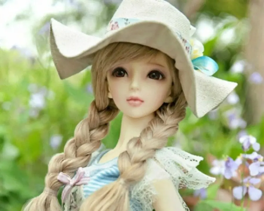 The most beautiful photo of a golden-haired girl doll in nature 2022