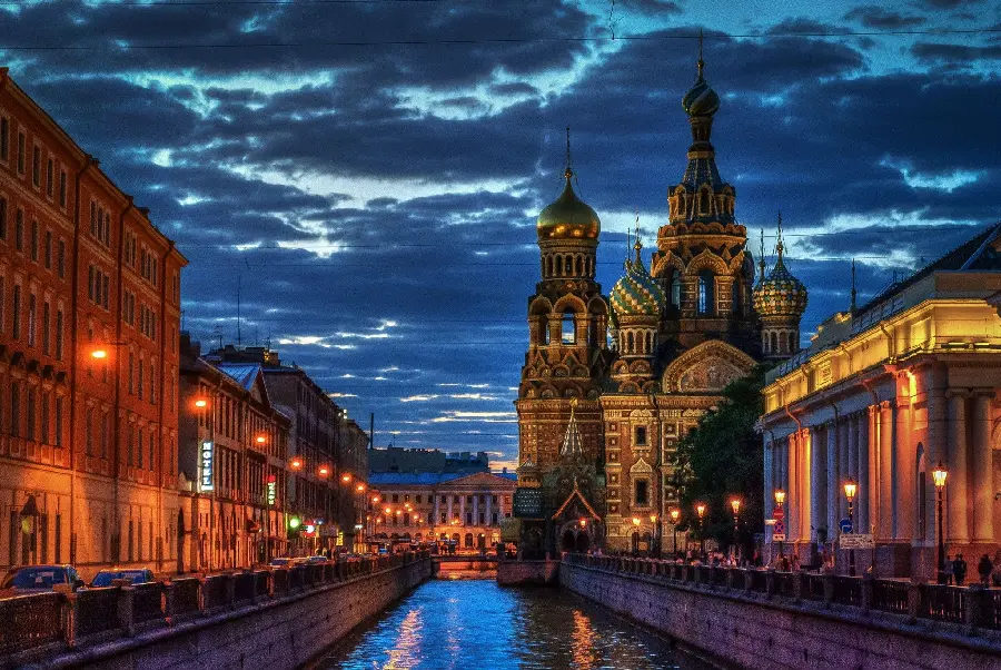 Download stock photo of masterpiece buildings by the river in the night view with bright lights of the city of St. Petersburg