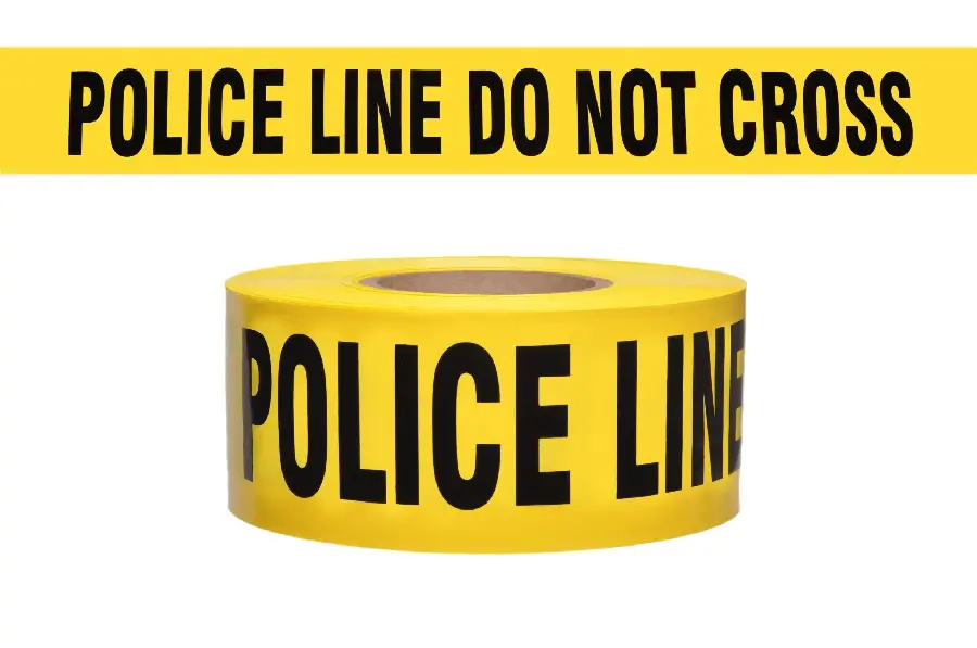 Photo of a no entry tape and a police warning with the famous yellow color