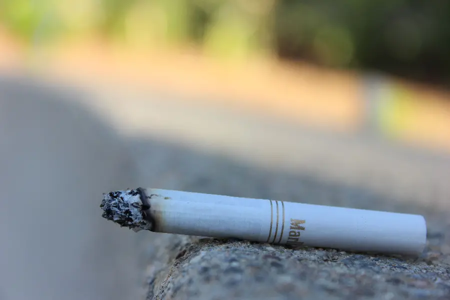 Marlboro Cigarettes Burning in the Corner of a Wall