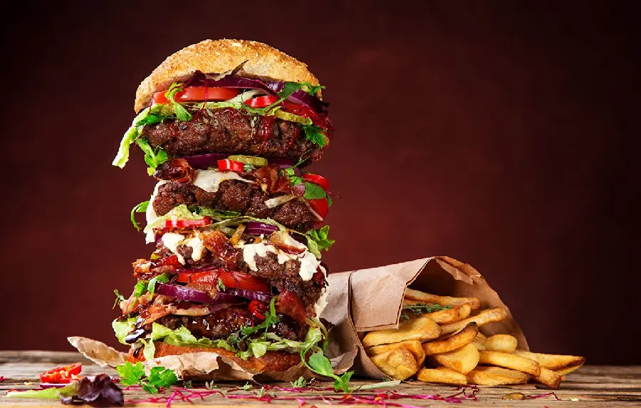 A Multi-Layered, Stuffed Hamburger in a Colorful and Glazed View