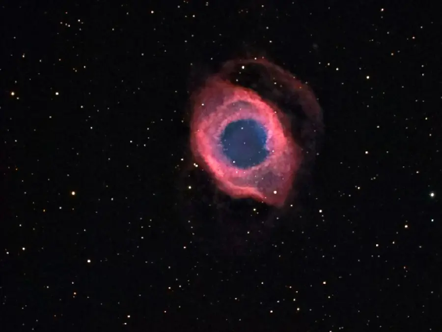 A new and attractive image of the Eye of God Nebula with a dark and starry sky background