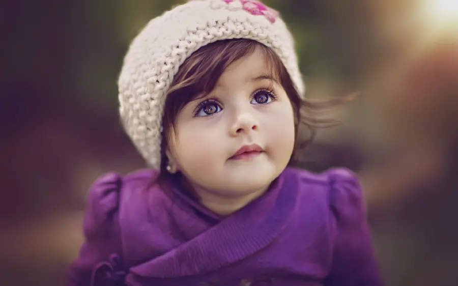 New photo of a beautiful little girl in a purple dress HD