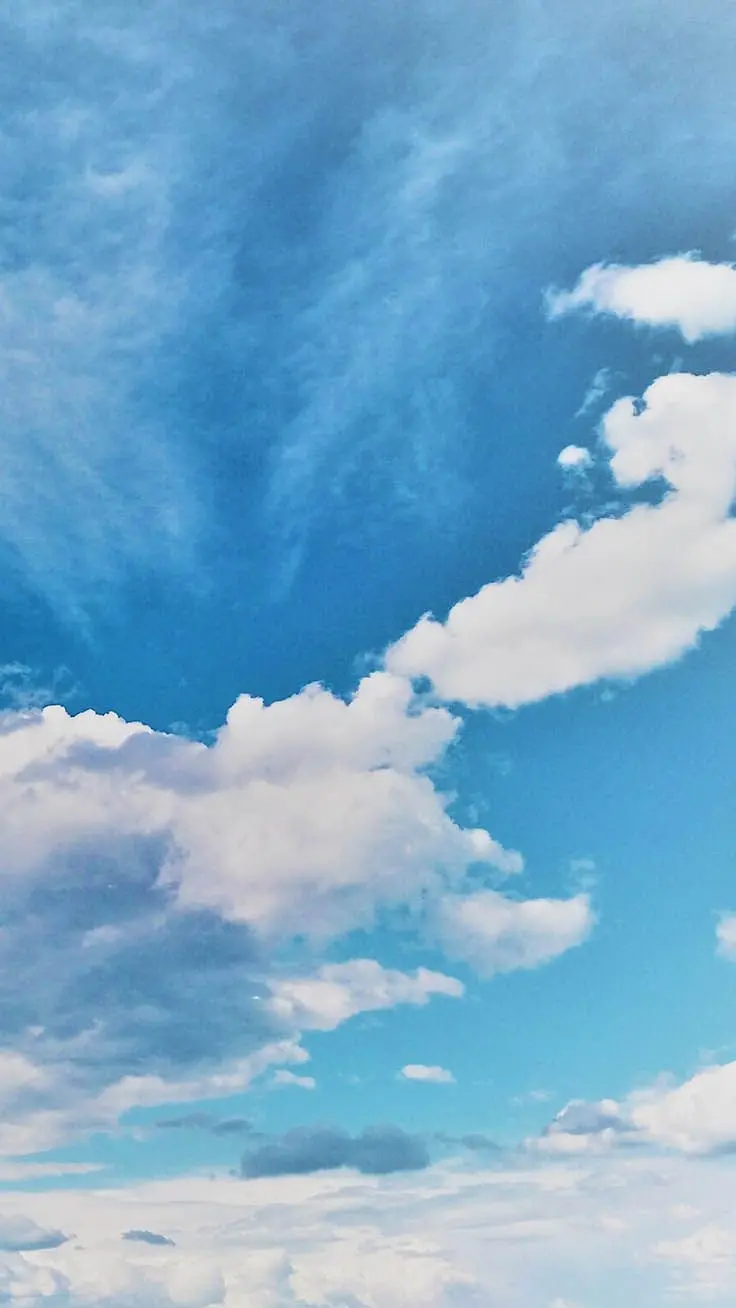 New and shabby stock image of azure blue sky with many clouds in high quality