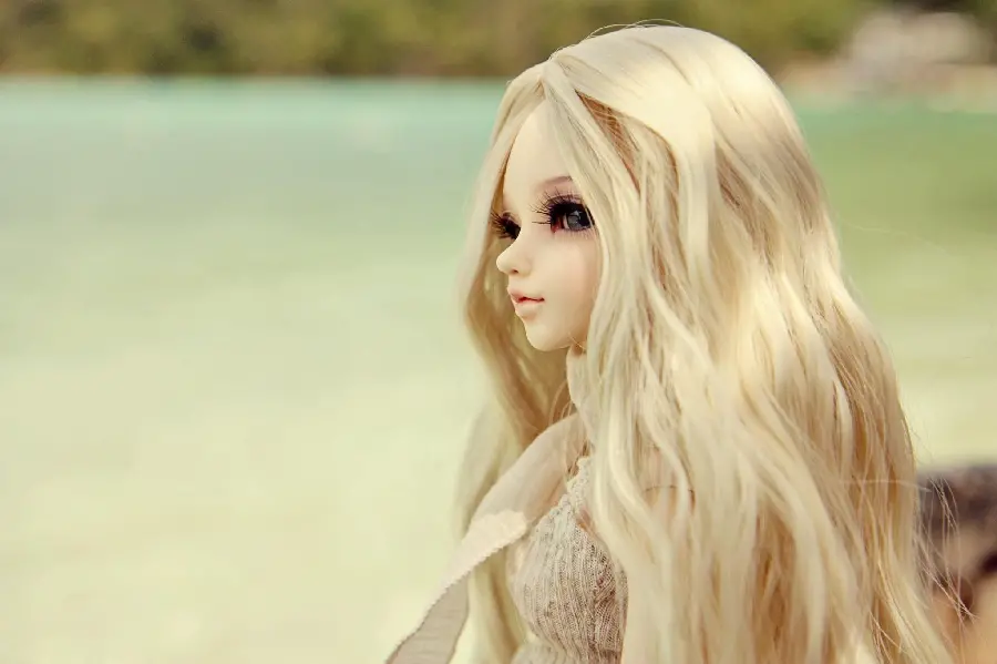 The most beautiful doll profile picture of a girl with long golden hair