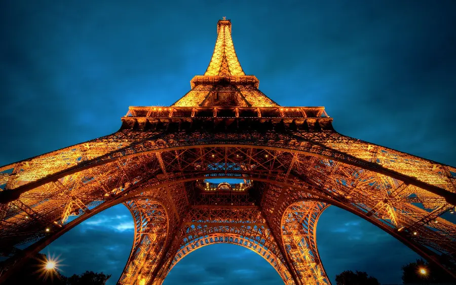 New fantasy and zoomed image at night of the foundations of the Eiffel Tower, a symbol of culture in Paris, a symbol of culture in France