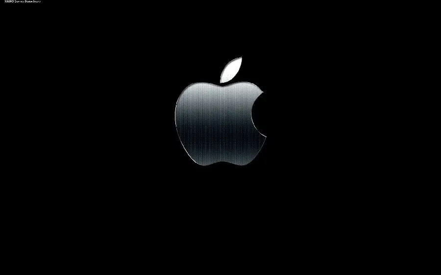 Image in the halo of darkness of a silver bitten apple on a black background in high quality
