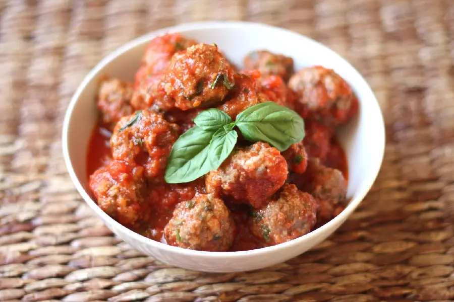 The freshest background of the appetizing food dumplings with sauce in a round bowl with a beautiful mint decoration suitable for Instagram