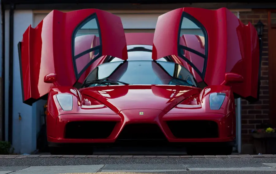 Top background of the red Ferrari Enzo with open doors in HD quality