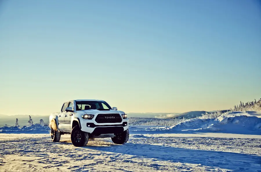 Enchanting Image of White Toyota Tacoma in a Wide Field of Snow