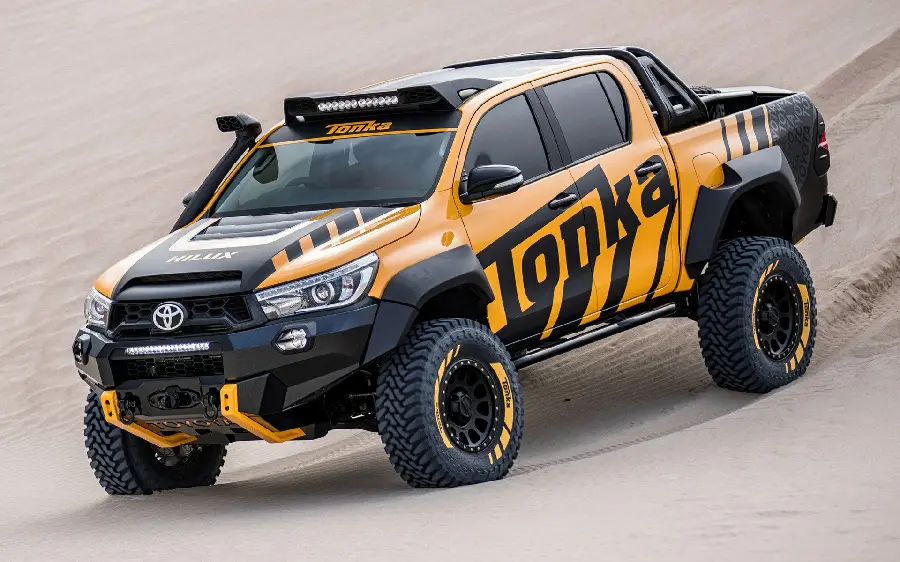 Stock Background of Yellow Toyota Hilux Offroad with Power in Desert
