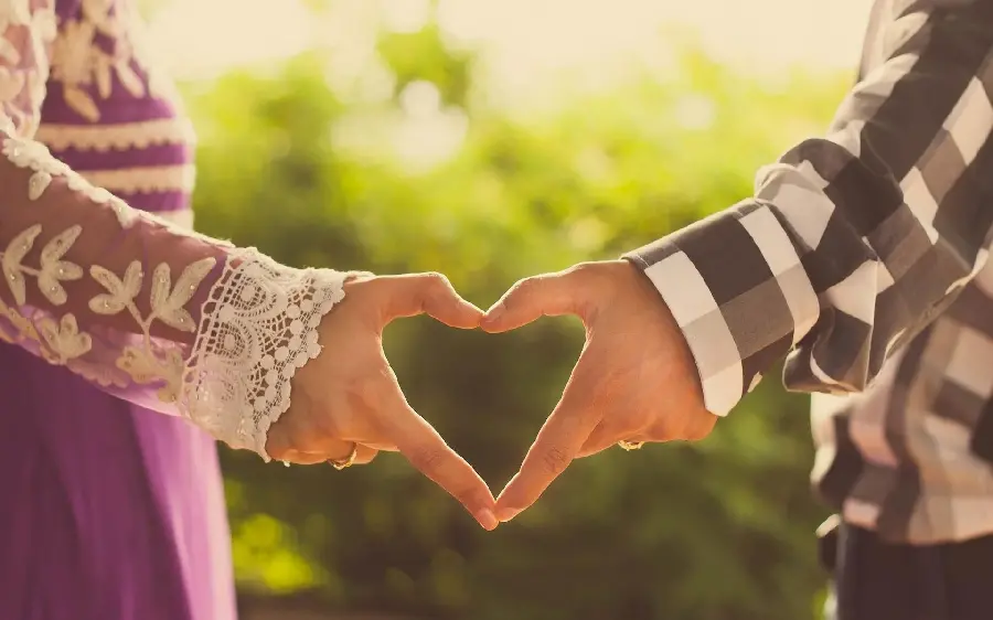 Sparkling romantic photo of making a heart with your hands for your profile