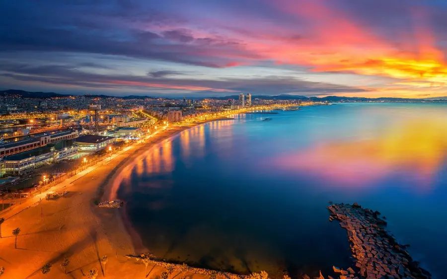 The background of the bright and beautiful tourist beach of Barcelona in HD quality, suitable for tablets