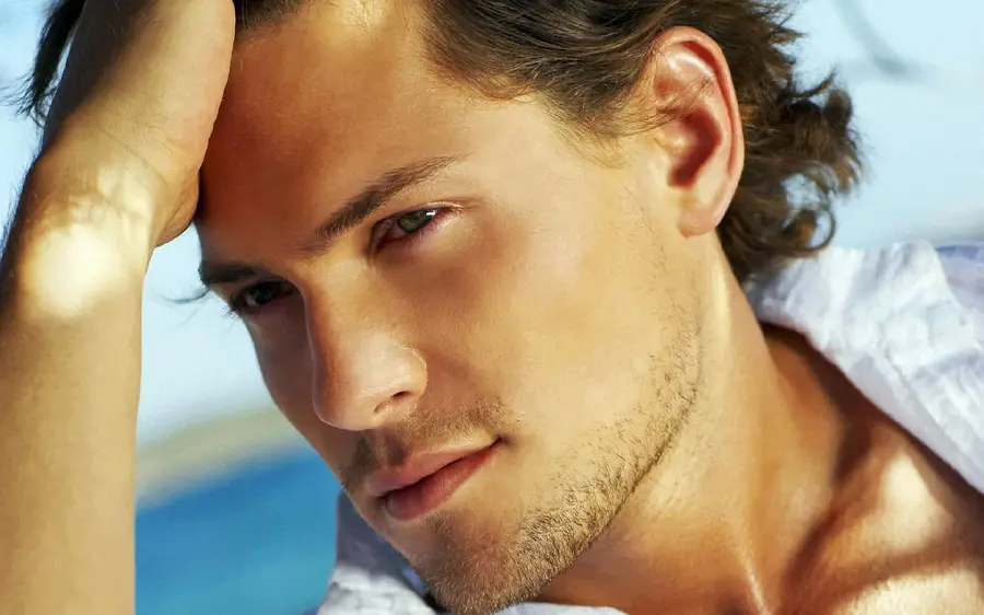 Young handsome model with a very bright facial expression in a special artistic view