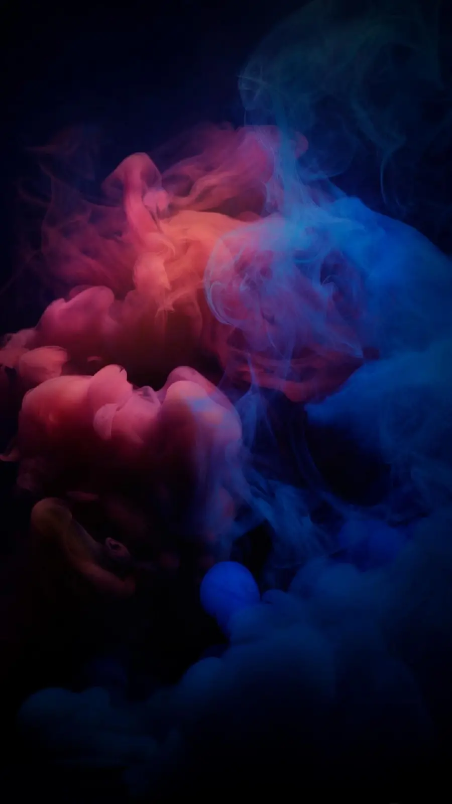 Interesting background of colored cigarette smoke with a black background