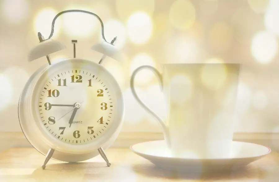 The latest dreamy picture of a clock and a cup with a white theme