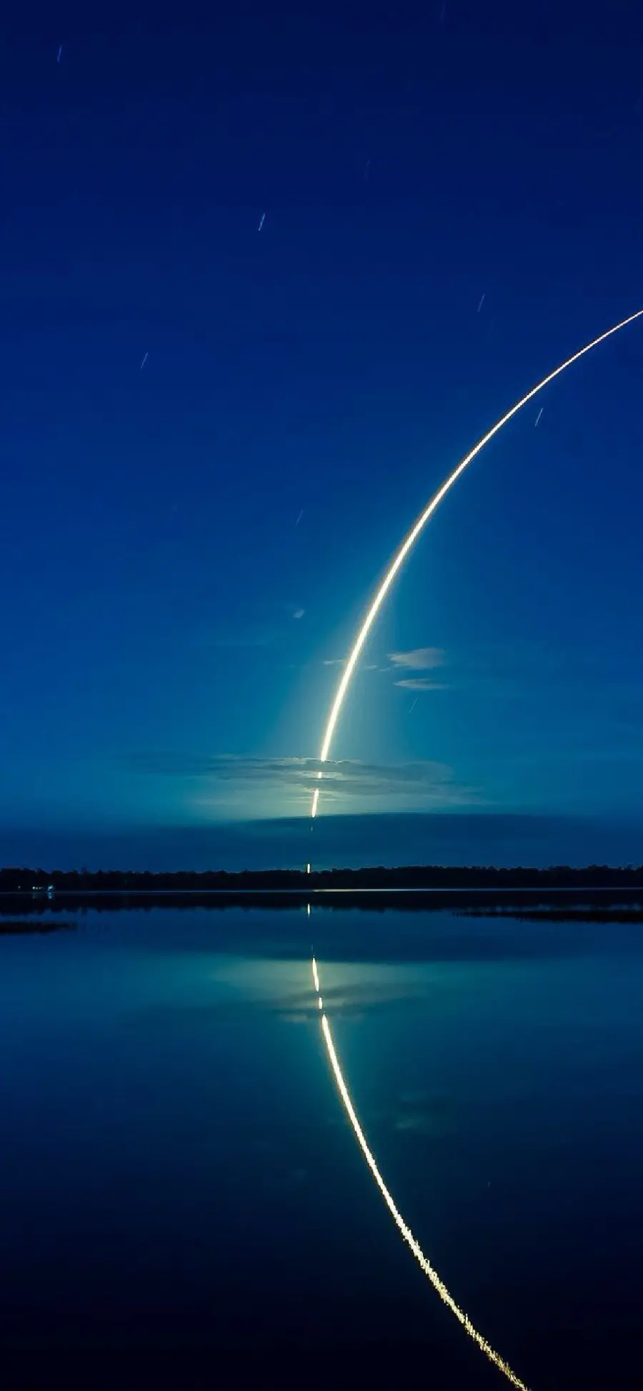 Beautiful and interesting photo of a rocket trail in the sky for your phone
