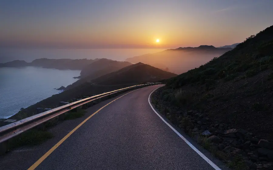 Mountain road and sunset photo