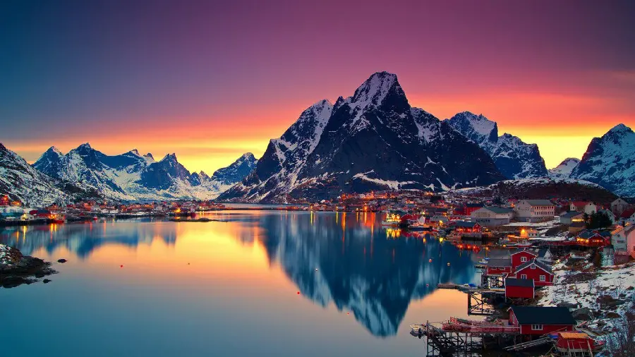 Beautiful lighted houses around the Scandinavian lake