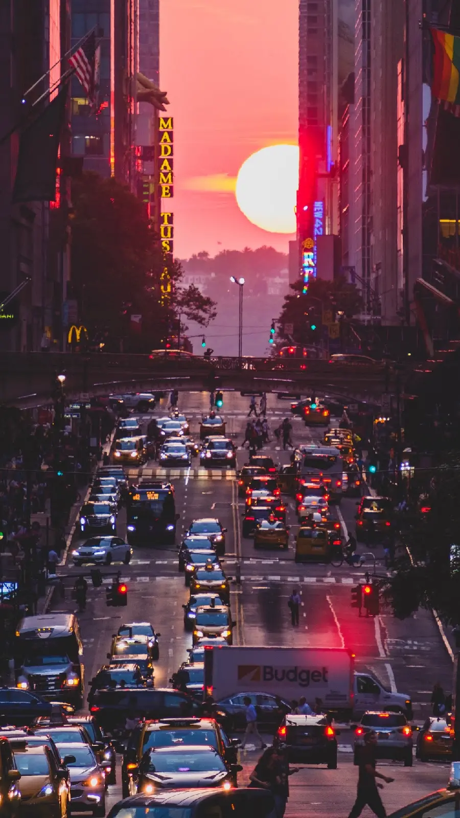 Photo of a busy street and sunset 