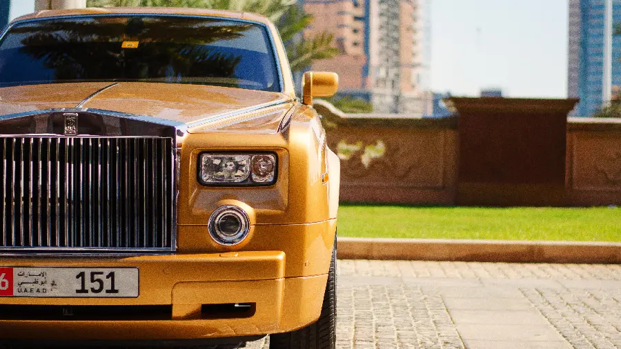 A magnificent picture of a yellow Rolls Royce luxury car in Dubai 2023
