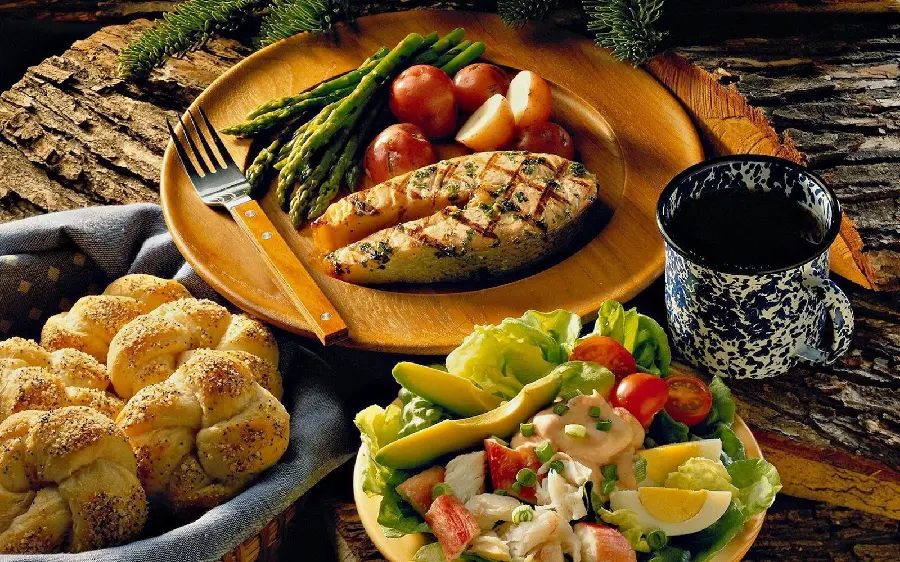 Stylish artistic photo of delicious meat food with bread and salad 