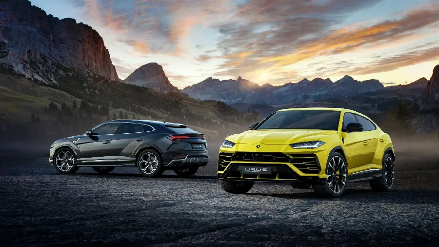  Two incredibly beautiful Lamborghini SUVs in a beautiful landscape for your desktop