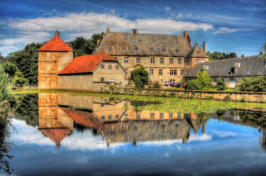 Beautiful houses by the water with red roofs wallpaper