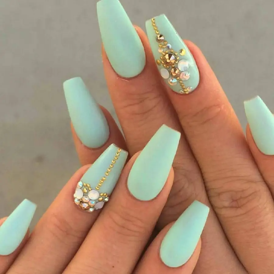 Girl's pastel green nail photo with jewel decoration for a party