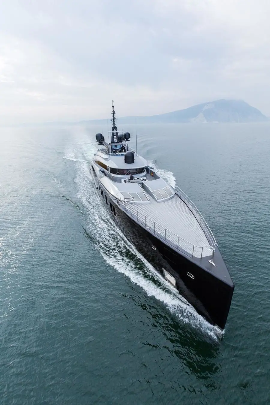 Background of a super luxurious boat with a spectacular black hull on the sea 1402