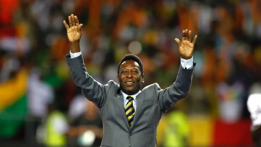 Picture of Pele, a Brazilian player in a suit at the end of his life