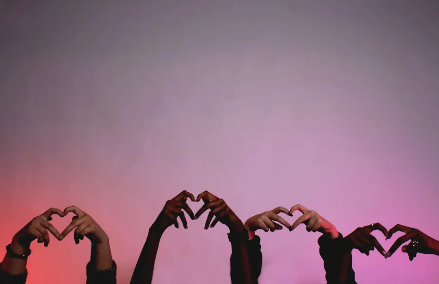Peaceful background of hands in the shape of a heart around the protection of human rights