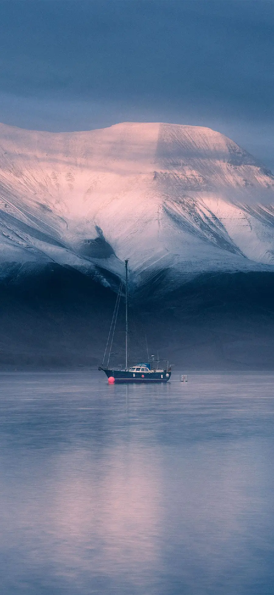 Download Background of a Dreamy Boat on the Water with a White Mountain Background