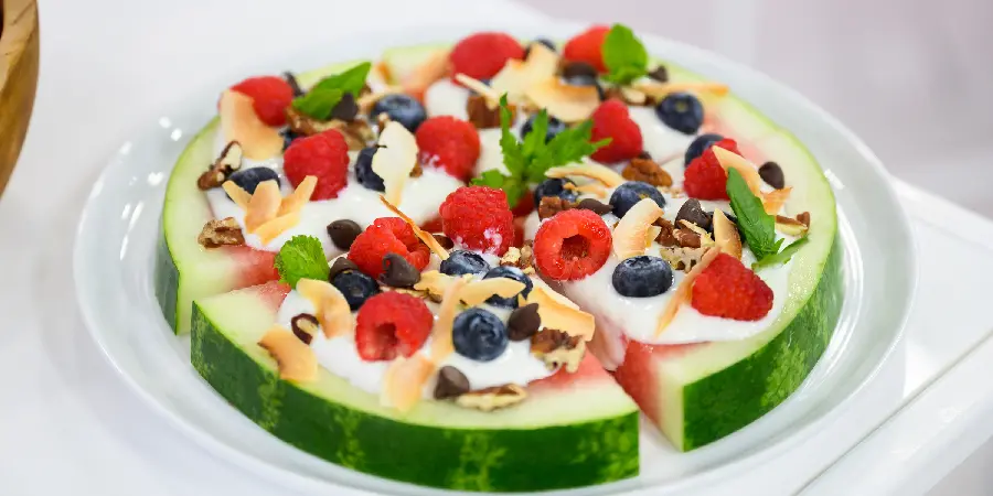 A photo of a delicious and beautiful fruit cake on a watermelon for ideas