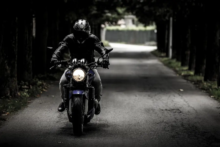 Profile photo of road and motorcycle with black background